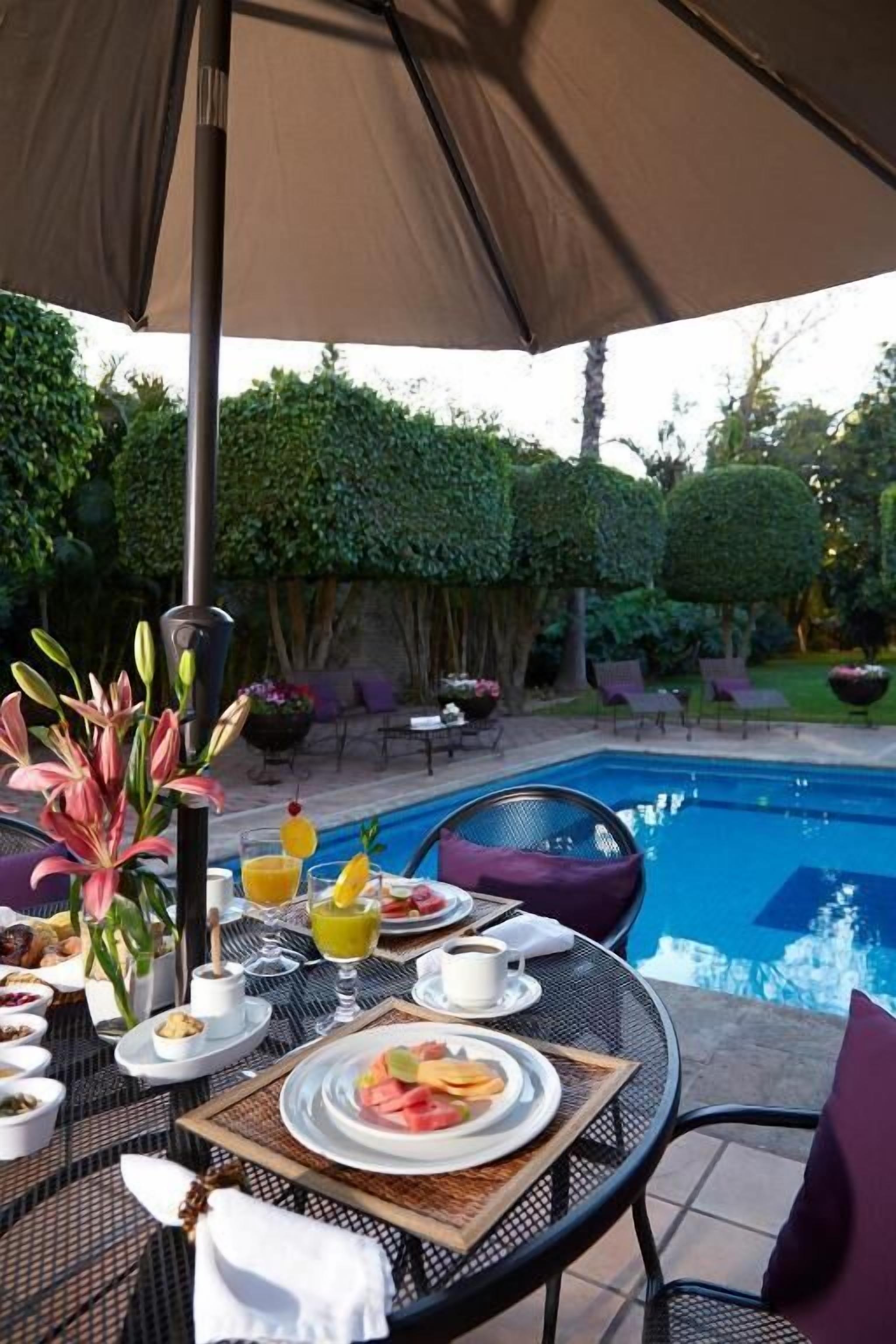 Outdoor pool, pool umbrellas, sun loungers