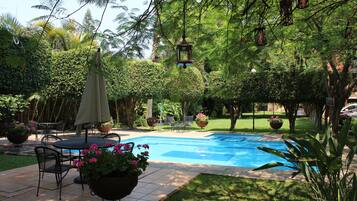 Outdoor pool, pool umbrellas, sun loungers