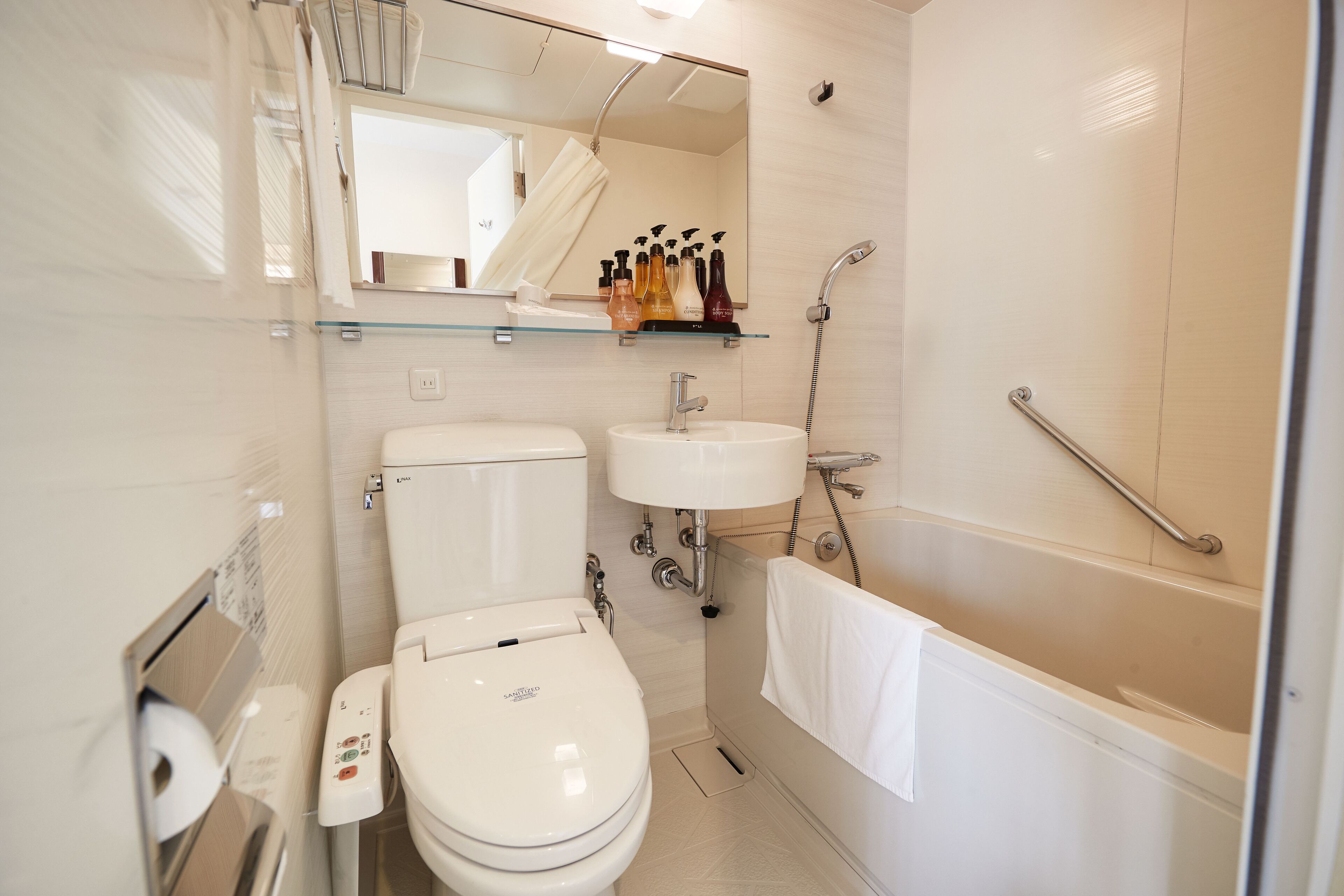 combined shower/bathtub, hair dryer, slippers, electronic bidet