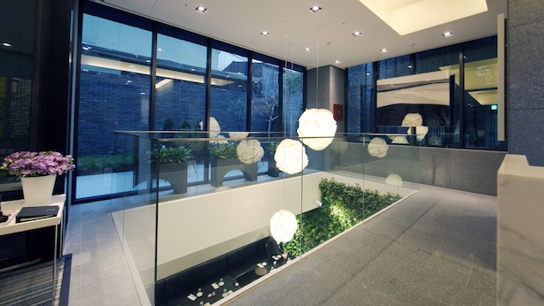 A modern interior with glass railings, recessed lighting, and a visible outdoor view through large windows. - STAY B Hotel Myeongdong (Seoul)