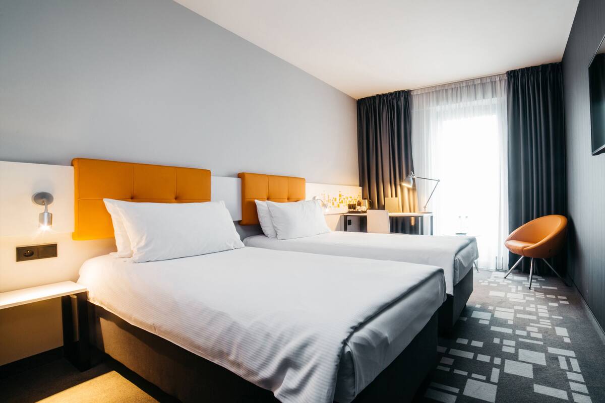 twin room, 2 single beds | in-room safe, desk, soundproofing, iron/ironing board