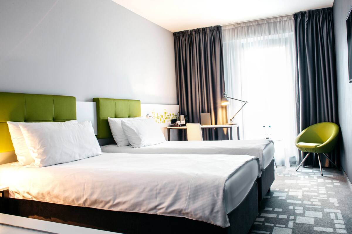 twin room, 2 single beds | in-room safe, desk, soundproofing, iron/ironing board