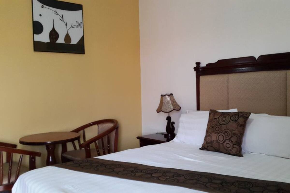 Standard Double Room Single Use | Minibar, in-room safe, laptop workspace, blackout drapes