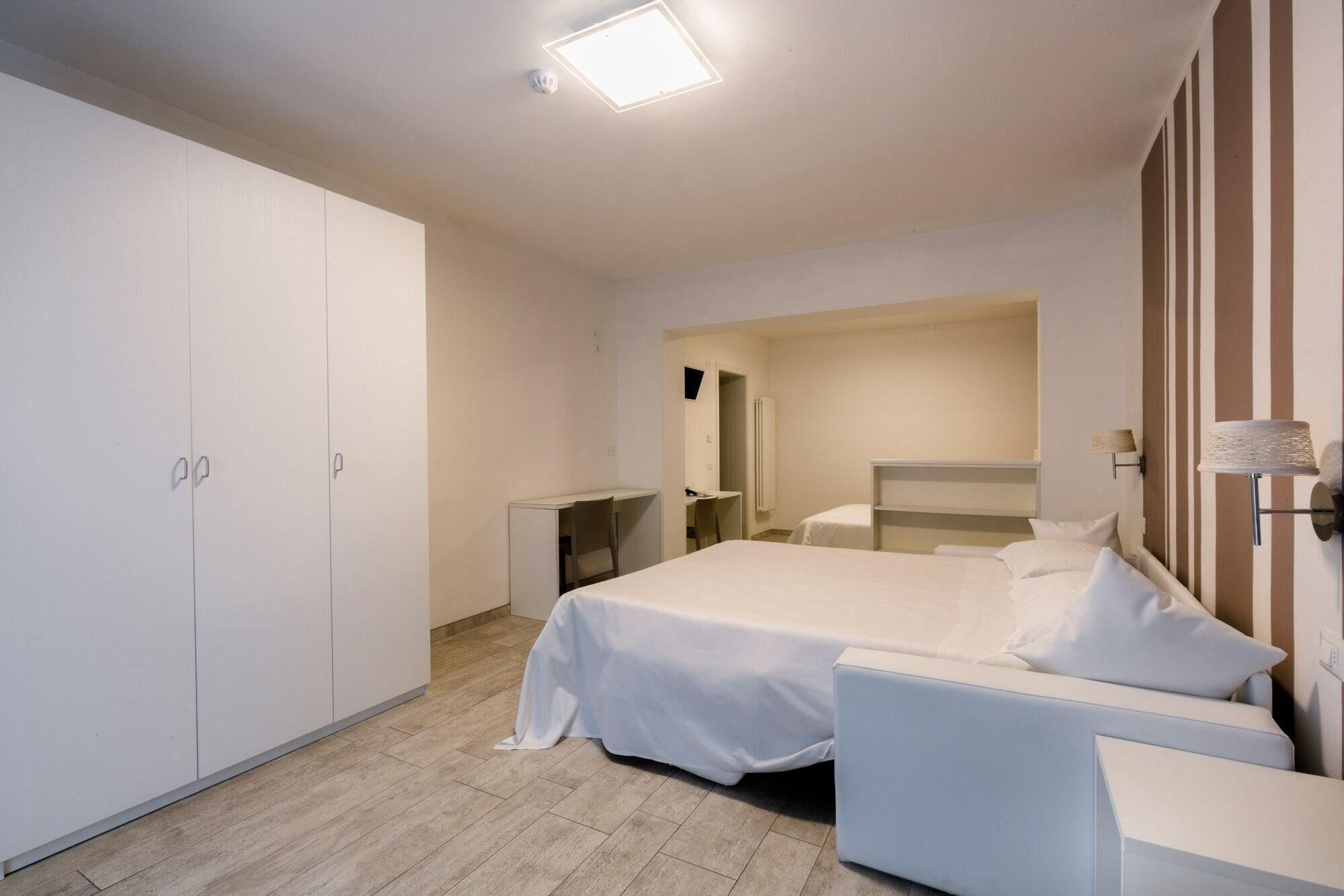 Family Room, Balcony, Partial Lake View | Desk, free WiFi, bed sheets