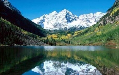 A mountain lake with clear reflections of the peaks.