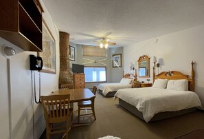 Enjoy a restful stay in this traditional room featuring a single bed, bedside table, and comfortable workspace.