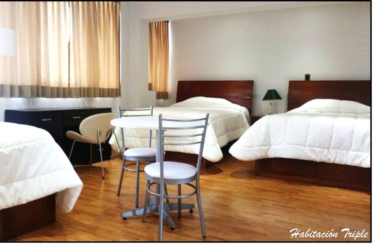 Triple Room | Minibar, in-room safe, desk, blackout curtains