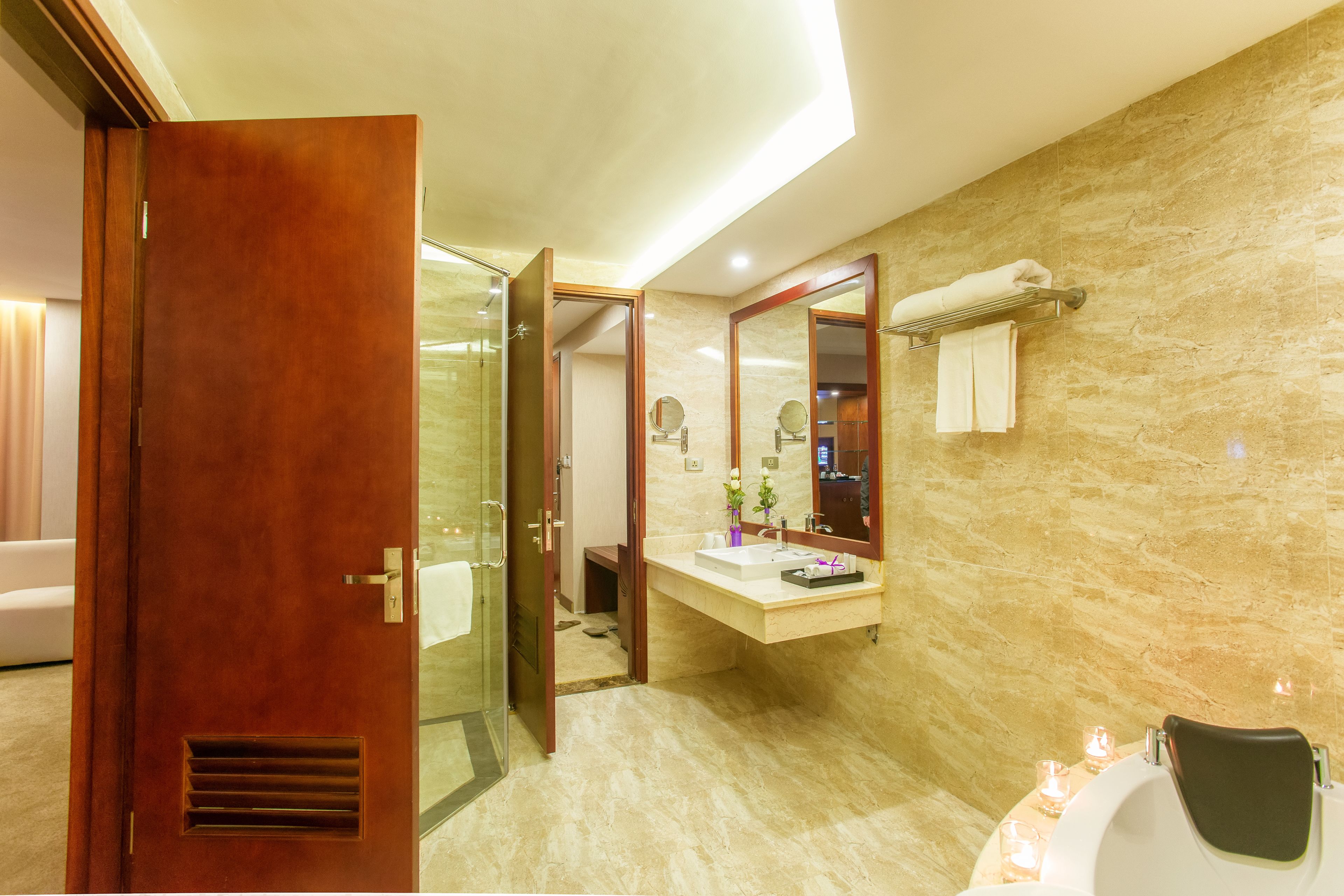 executive suite | bathroom | rainfall showerhead, designer toiletries, hair dryer, towels