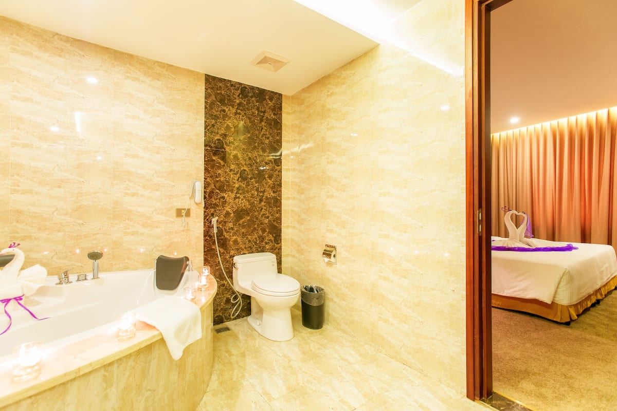 executive suite | bathroom | rainfall showerhead, designer toiletries, hair dryer, towels