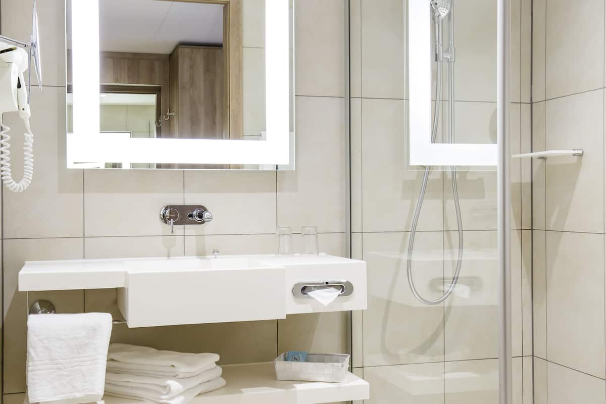 shower, eco-friendly toiletries, hair dryer, slippers