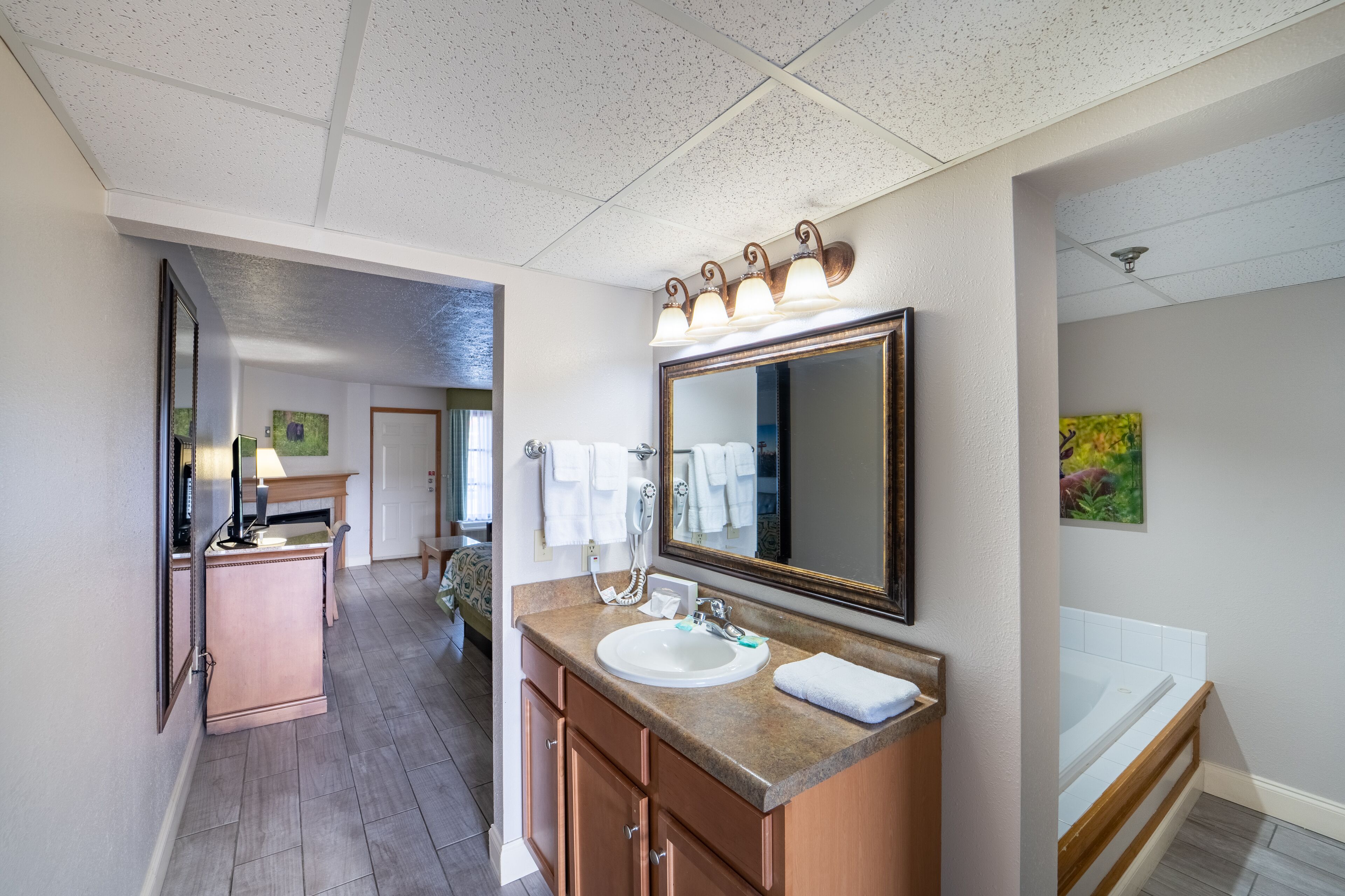 romantic suite, 1 king bed, jetted tub | bathroom sink