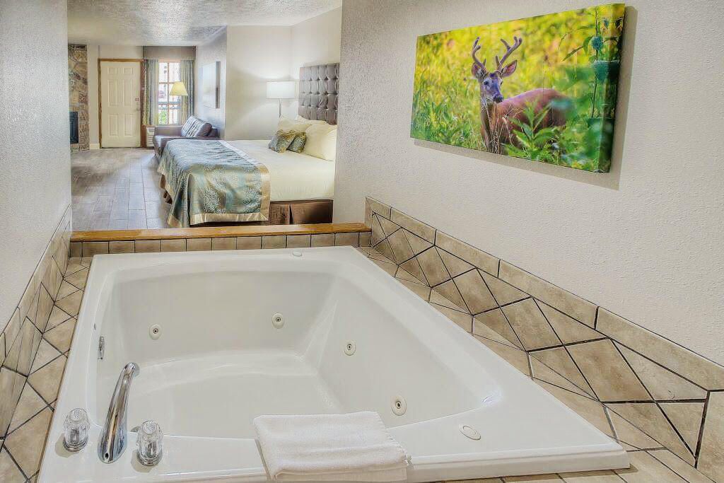 romantic suite, 1 king bed, jetted tub | desk, laptop workspace, blackout curtains, iron/ironing board