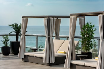 Outdoor pool, cabanas (surcharge), pool umbrellas at AC Hotel by Marriott Miami Beach