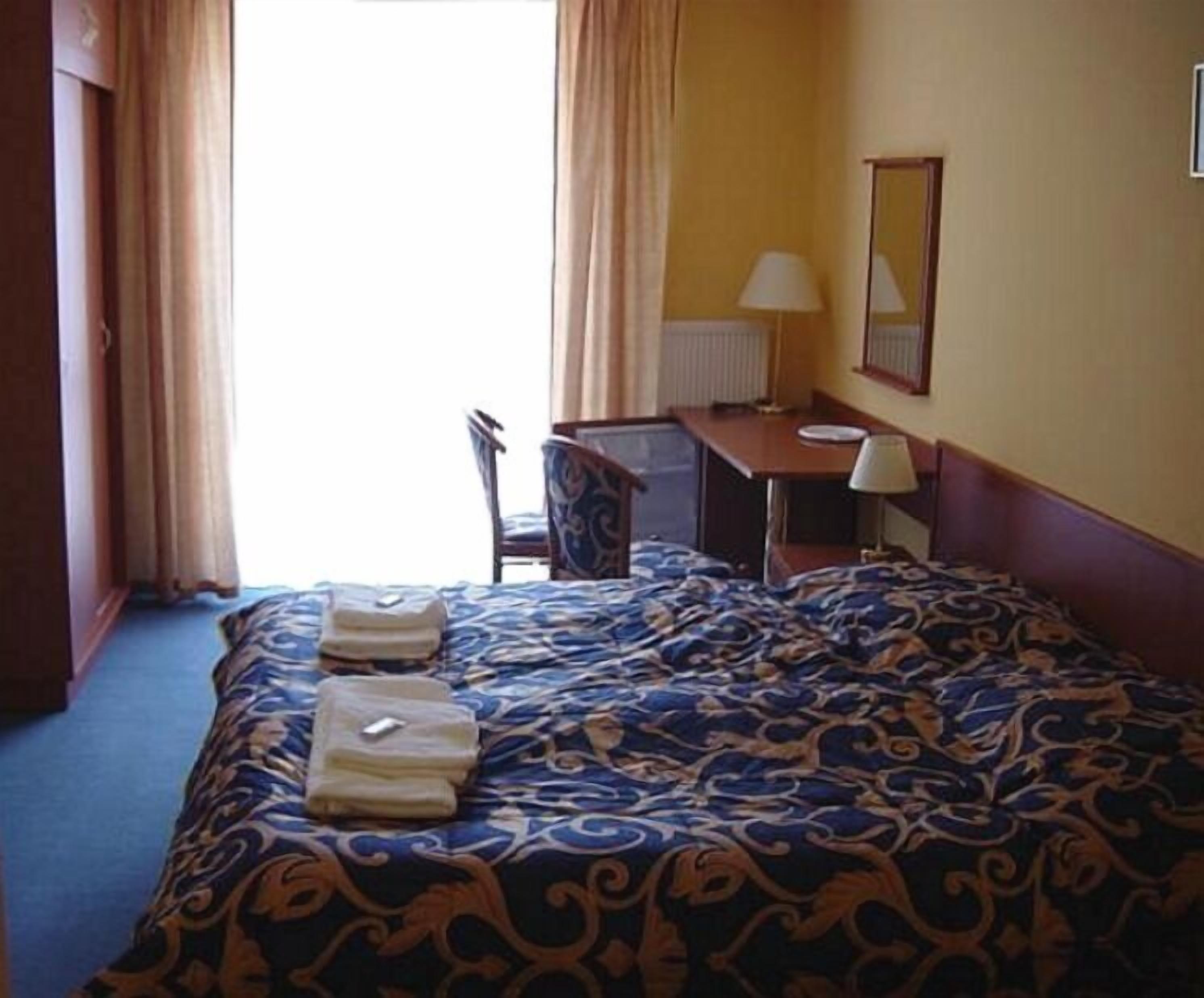 double or twin room | in-room safe, desk, blackout curtains, free wifi