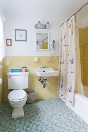 Standard Room, 2 Queen Beds | Bathroom | Combined shower/tub, free toiletries, hair dryer, towels