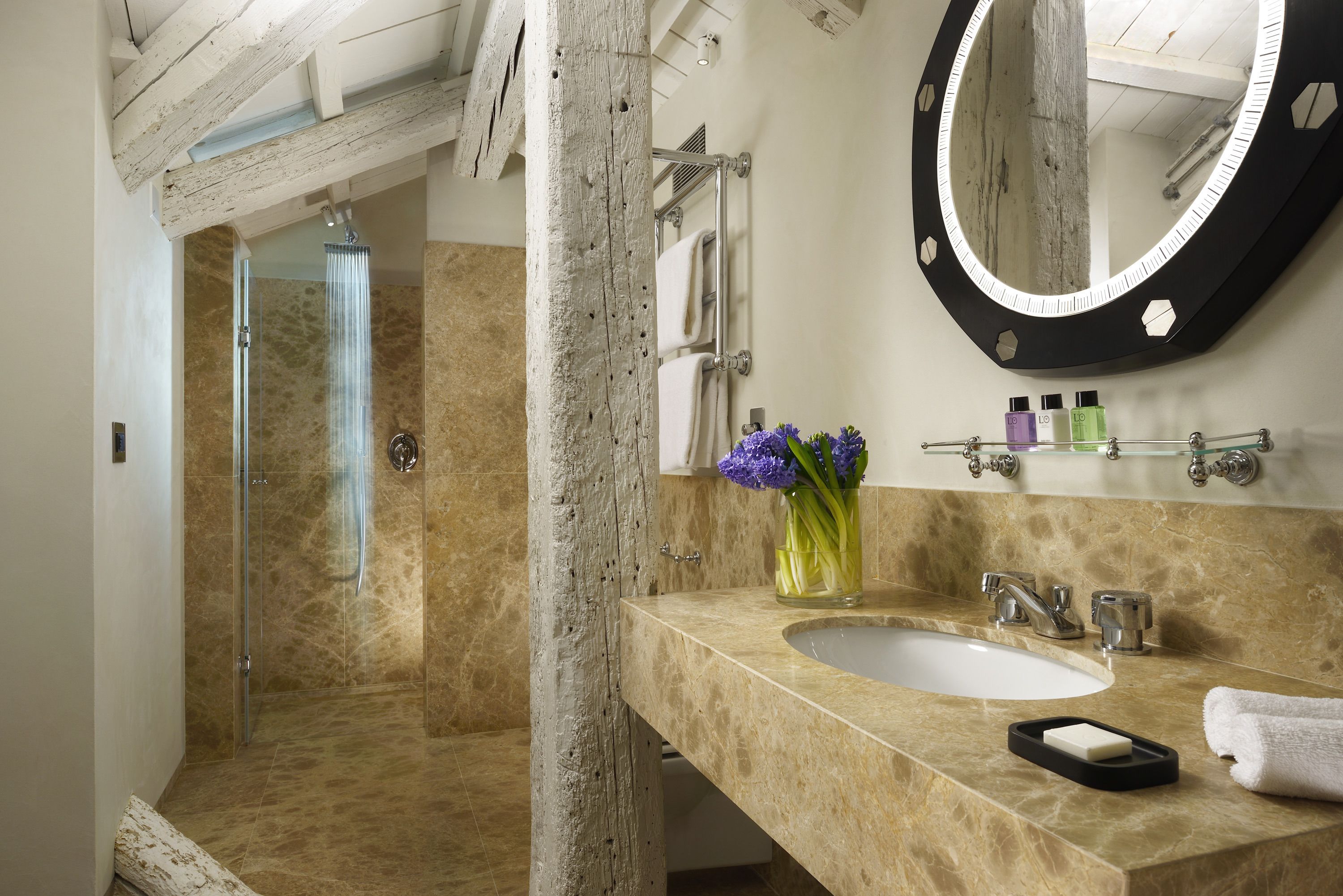 deluxe suite | bathroom | designer toiletries, hair dryer, slippers, bidet