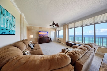 In-room television and other amenities at Palmetto Beachfront Hotel, a By the Sea Resort