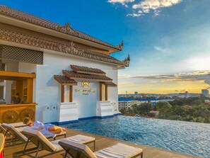 Outdoor pool, an infinity pool, open 6 AM to 7 PM, pool umbrellas - Yadanarpon Dynasty Hotel (Mandalay)