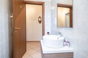 Shower, free toiletries, hair dryer, slippers