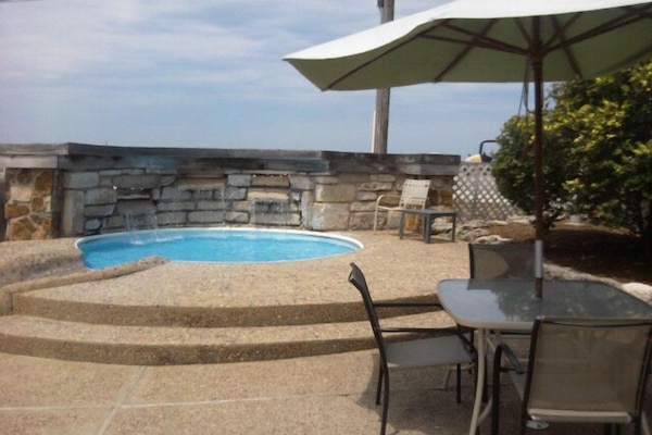 Seasonal outdoor pool, open 7:00 AM to 11:00 PM, pool umbrellas