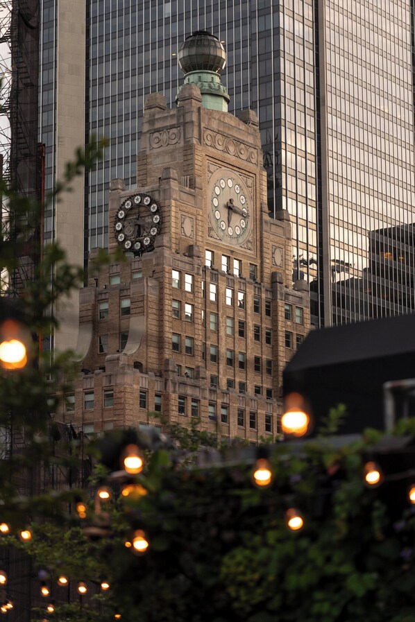 A historic building with a prominent clock tower and a large clock face.