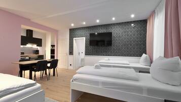 Standard Condo, 1 Bedroom (Excluding 85 Euro Cleaning Fee) | Living area | Flat-screen TV