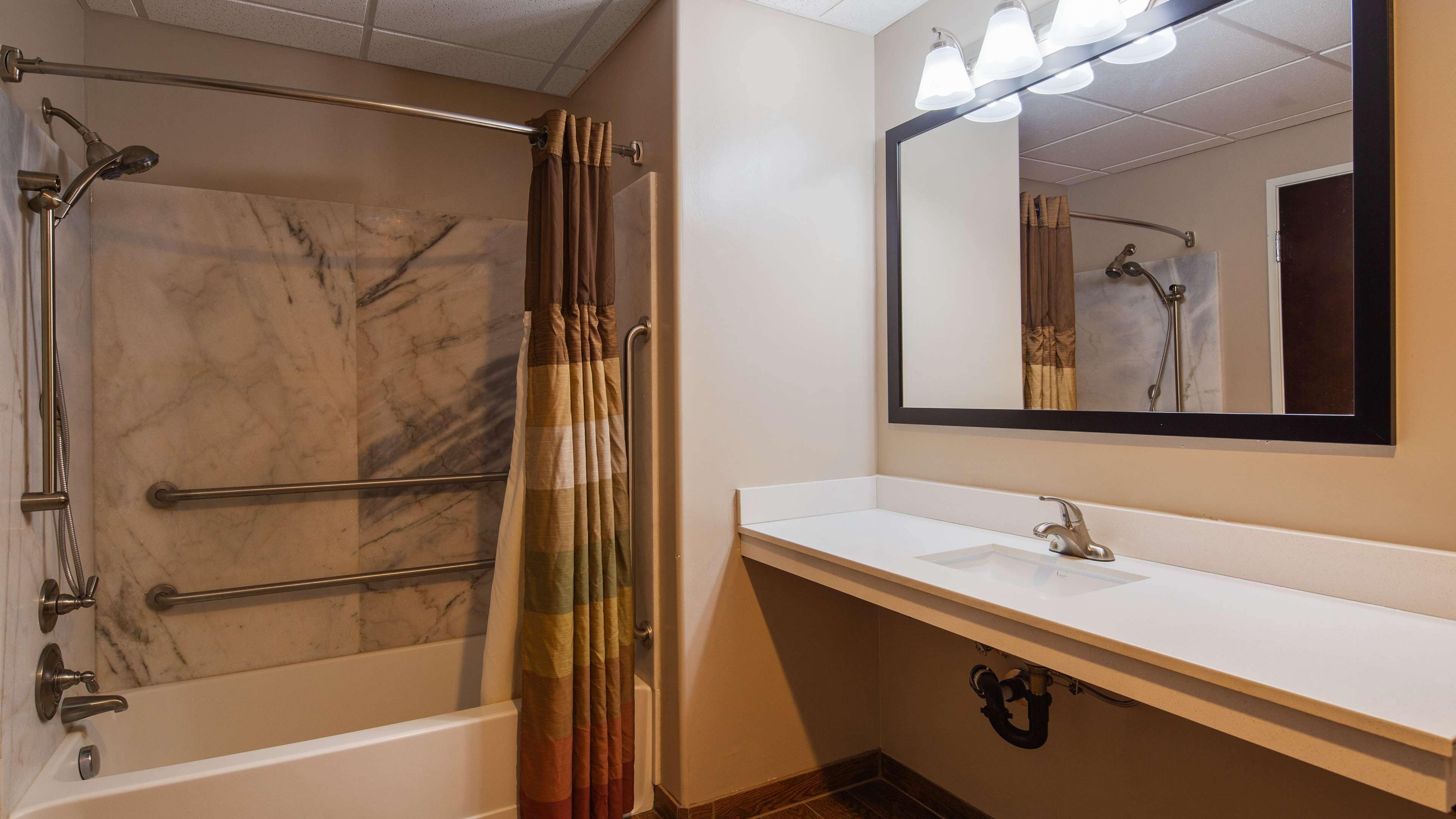 suite, 1 king bed, accessible, bathtub | bathroom | hair dryer, towels