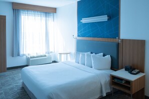 Desk, laptop workspace, iron/ironing board, free cribs/infant beds