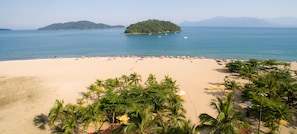 On the beach, beach cabanas, beach umbrellas