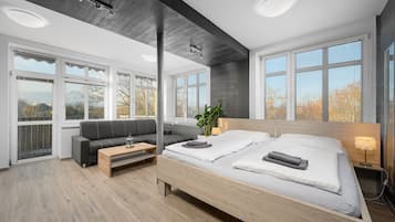 Appartement, uitzicht op tuin | Een kluis op de kamer, gratis wifi, beddengoed