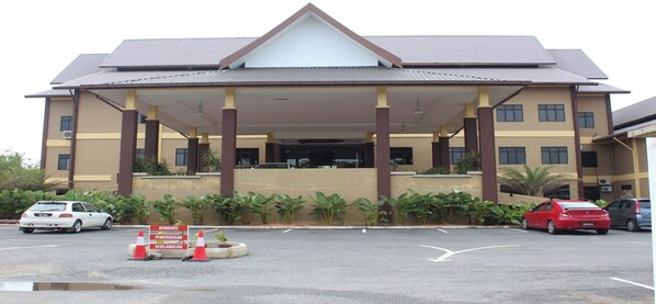 Stunning multi-story building with a grand entrance and covered walkway.