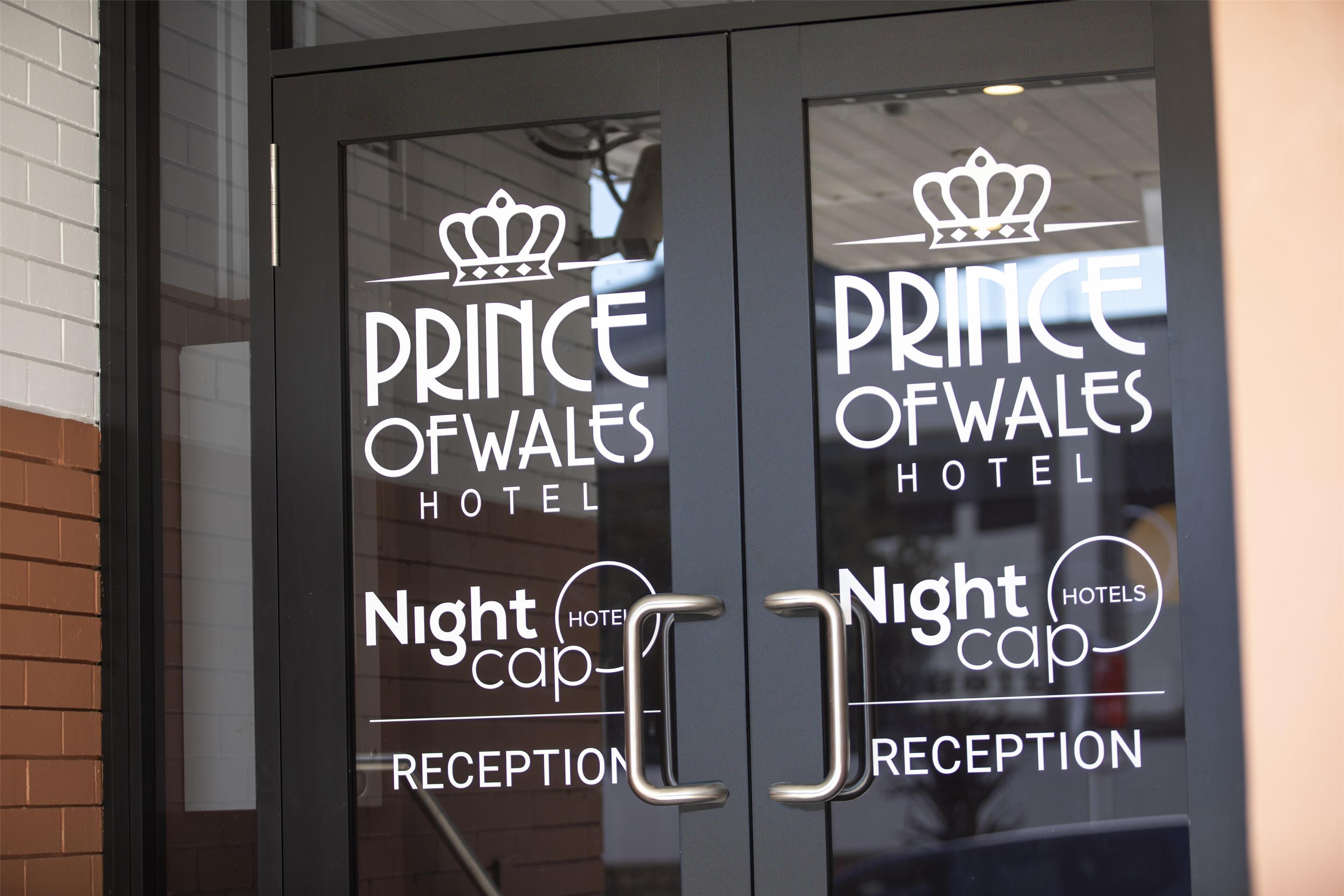 A hotel entrance with "Prince of Wales Hotel" signage and "Nightcap Reception" labels.