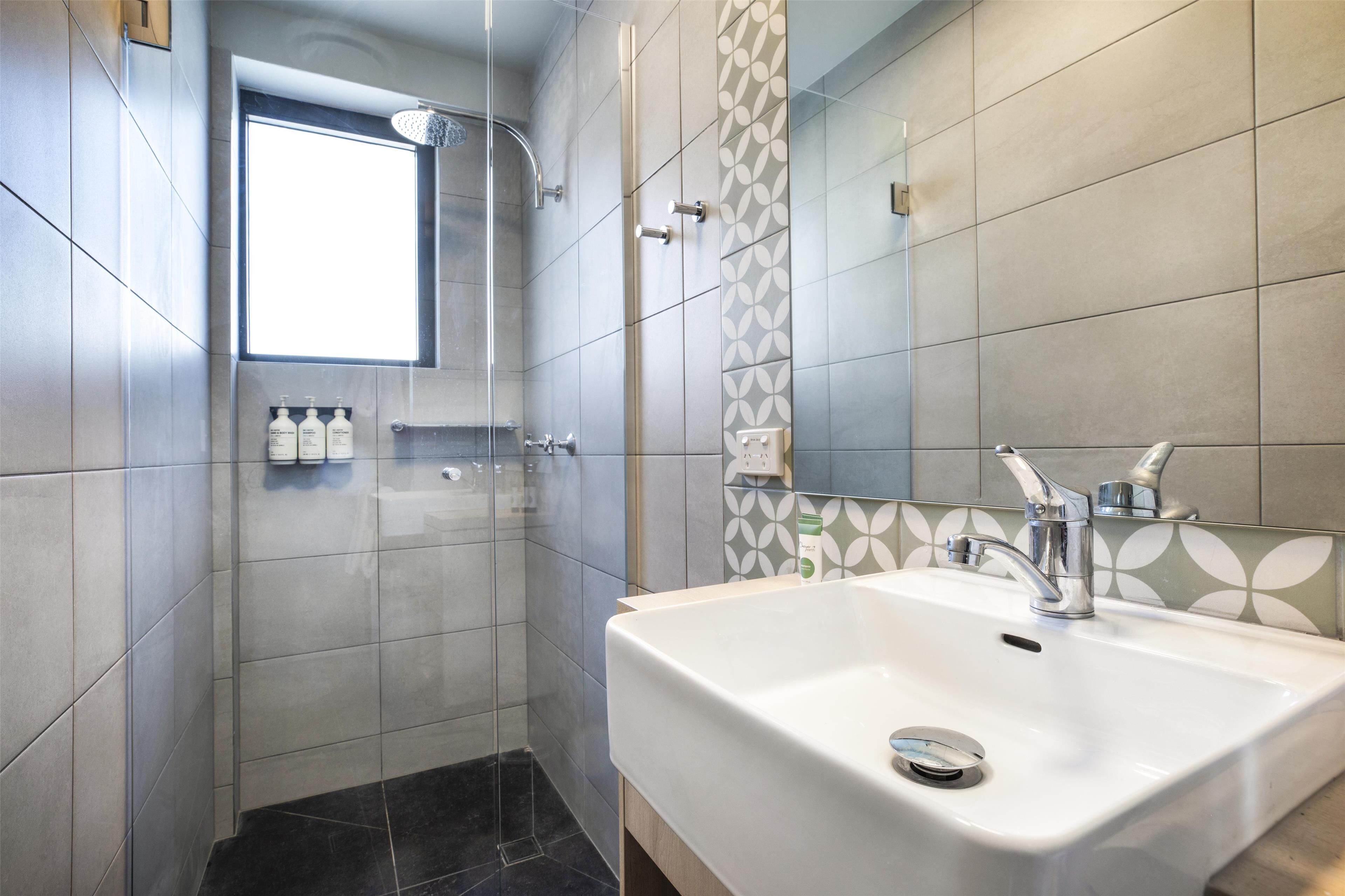 two bedroom apartment | bathroom | shower, rainfall showerhead, eco-friendly toiletries, hair dryer