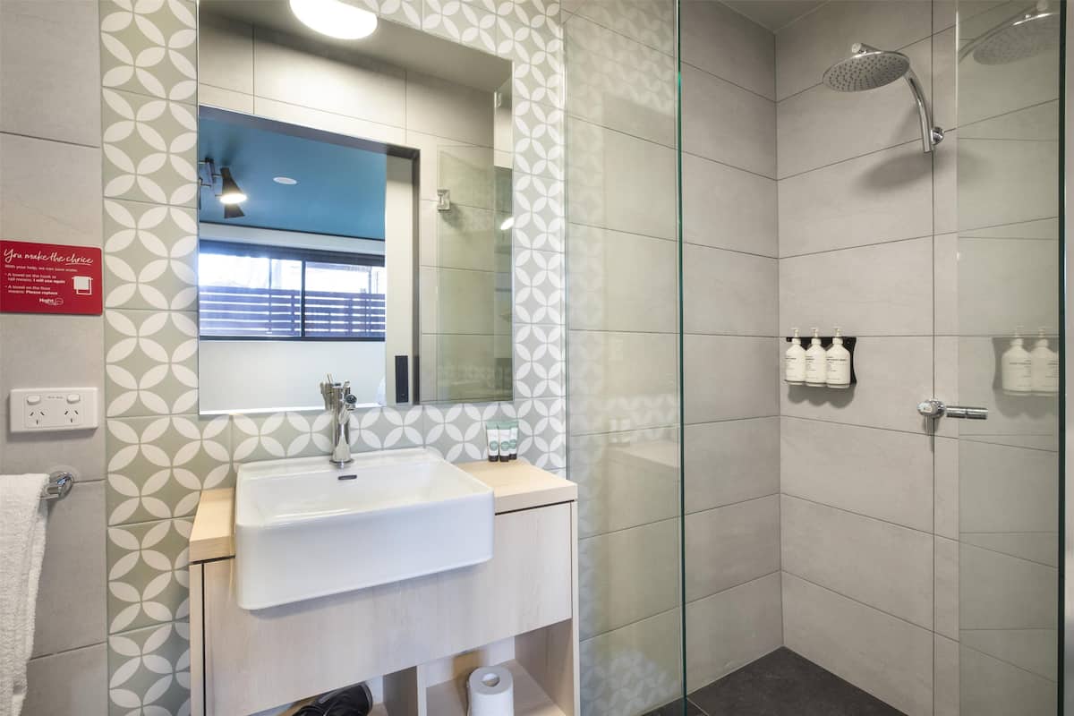 compact queen | bathroom | shower, rainfall showerhead, eco-friendly toiletries, hair dryer