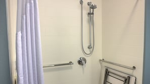 A bathroom with a shower, a towel rack, and a toilet. - Holiday Inn Express & Suites Spencer by IHG (Spencer)