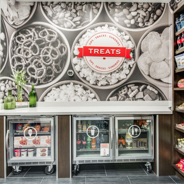 A refrigerated display case with various frozen treats and snacks.