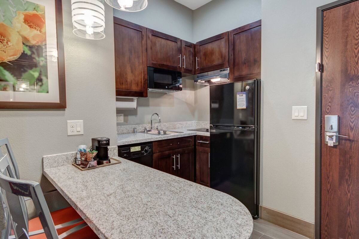 full-sized fridge, microwave, stovetop, dishwasher