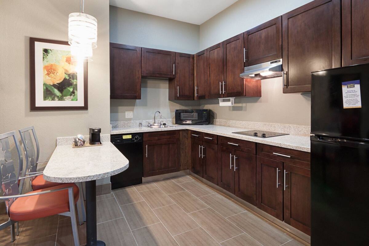 full-sized fridge, microwave, stovetop, dishwasher