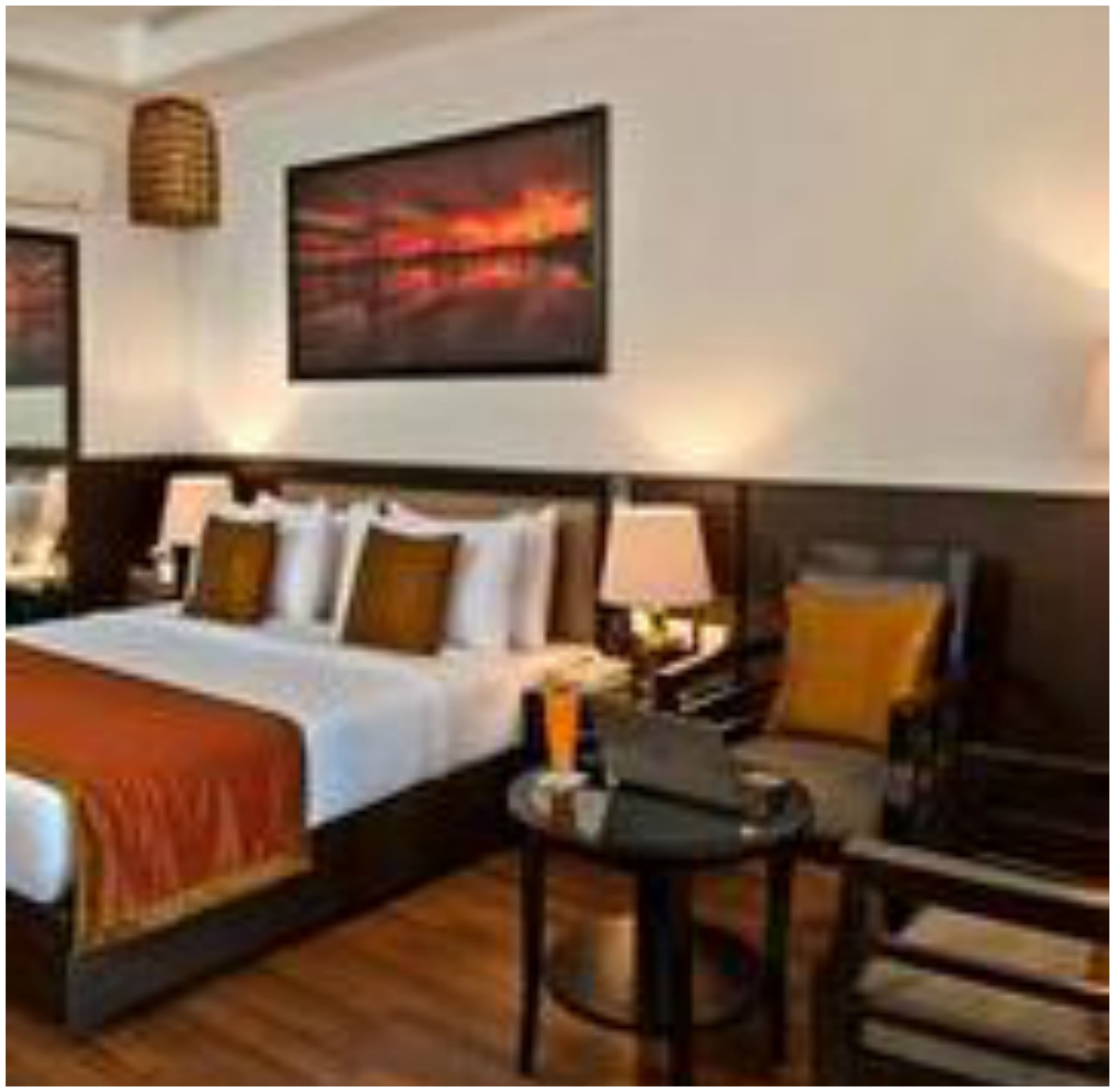 deluxe room | minibar, in-room safe, desk, iron/ironing board