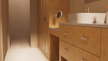 A modern bathroom with wooden cabinets, a sink, and a mirror.