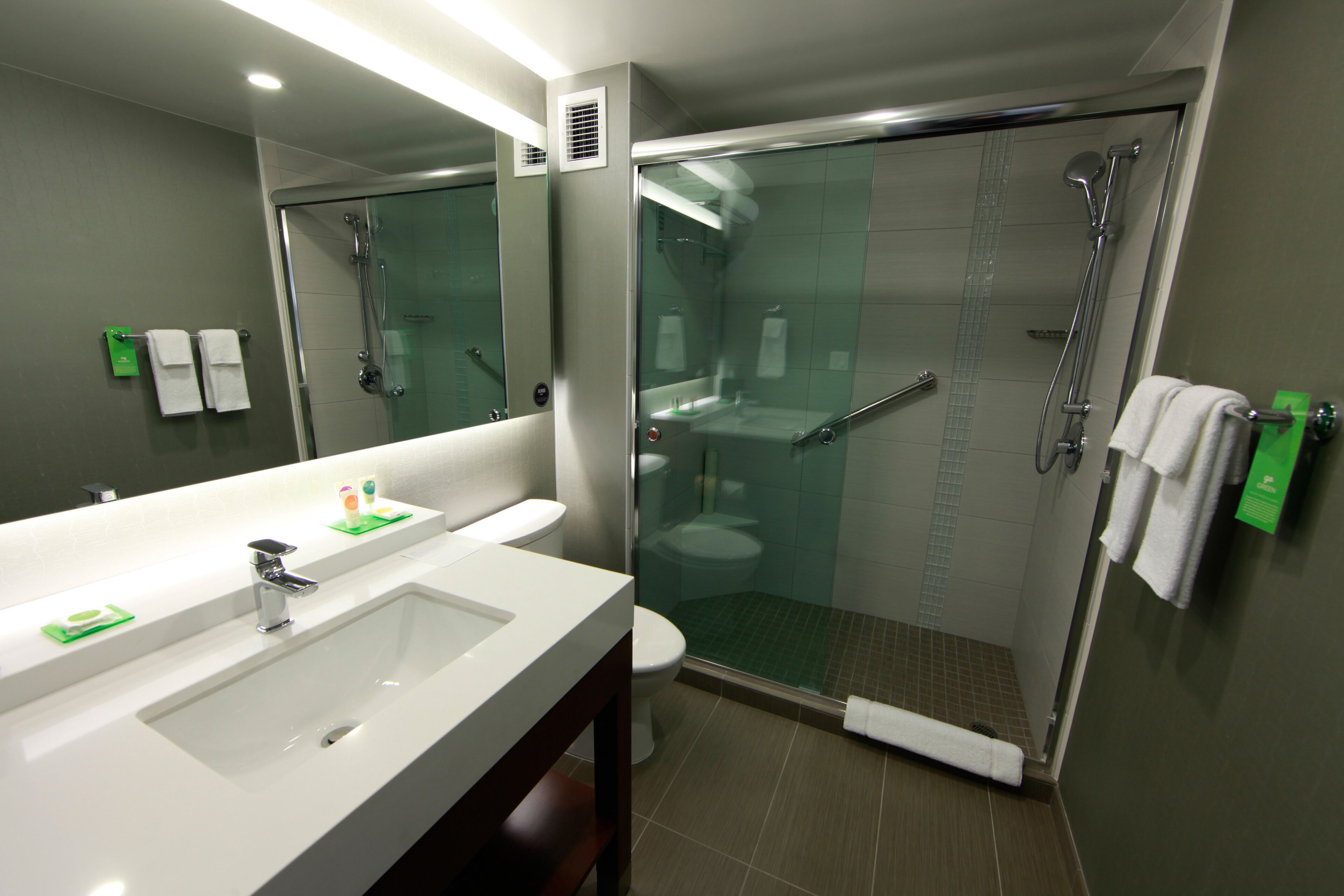 designer toiletries, hair dryer, towels