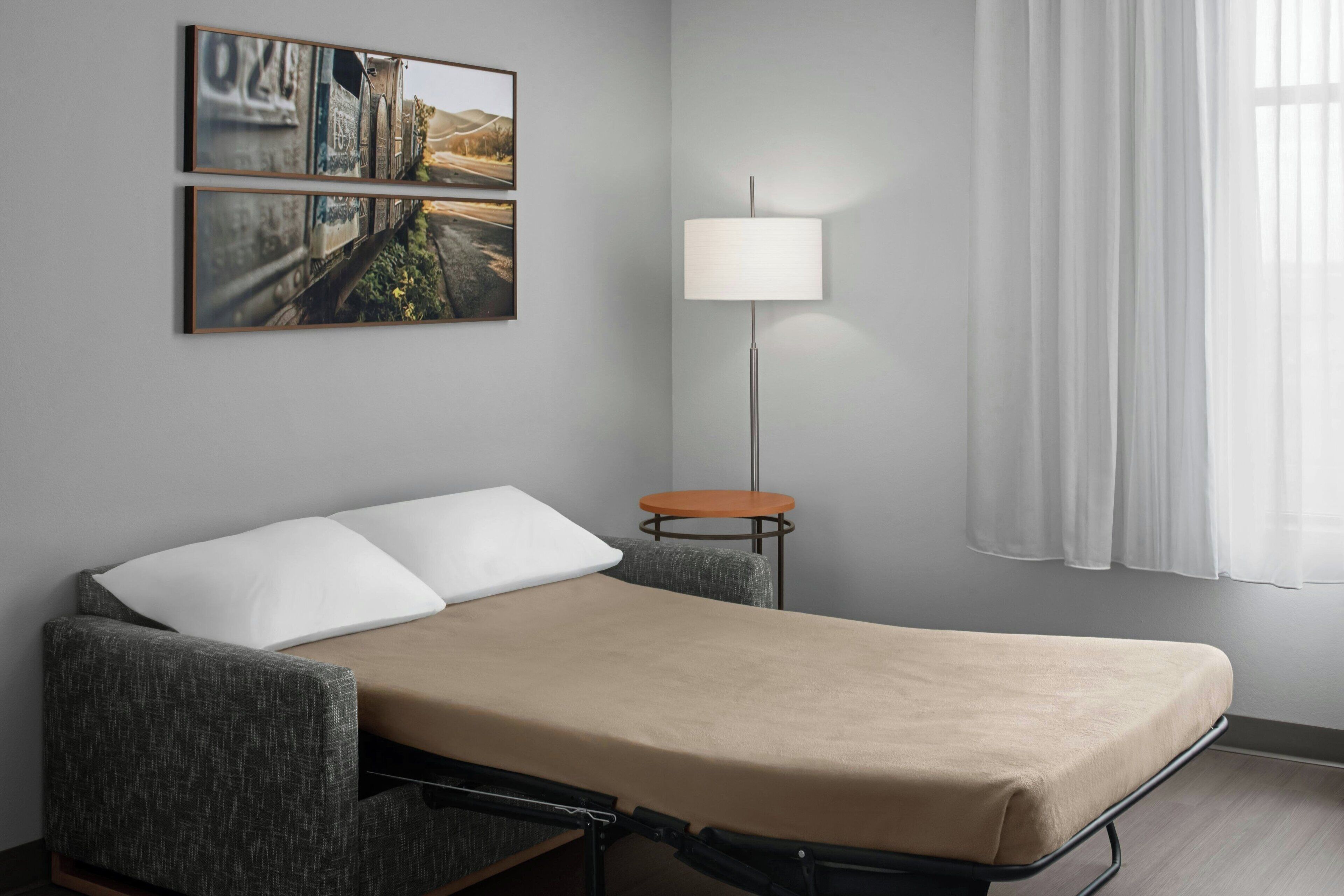 laptop workspace, blackout curtains, iron/ironing board