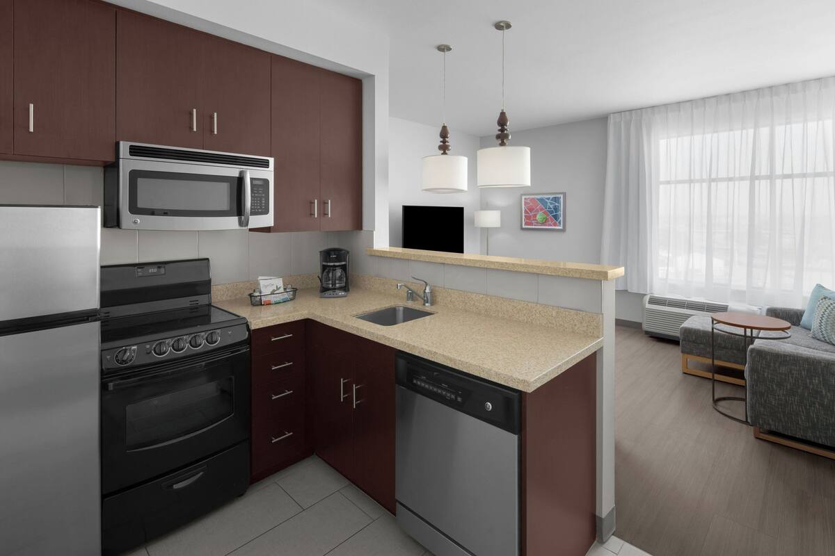 laptop workspace, blackout curtains, iron/ironing board