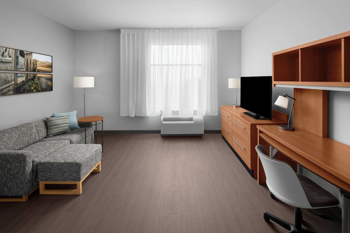 laptop workspace, blackout curtains, iron/ironing board