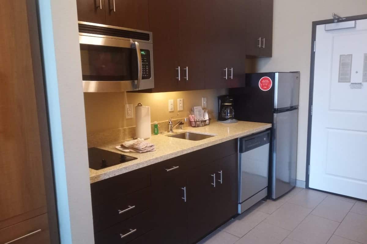 full-sized fridge, microwave, stovetop, dishwasher