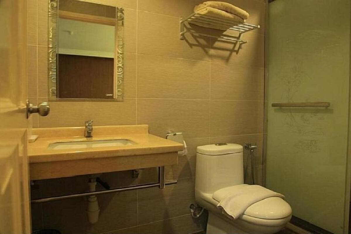 Shower, hair dryer, slippers, towels