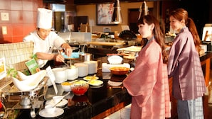 A buffet setup with various dishes and utensils. - Kotohira Grand Hotel Sakuranosho (Kotohira)