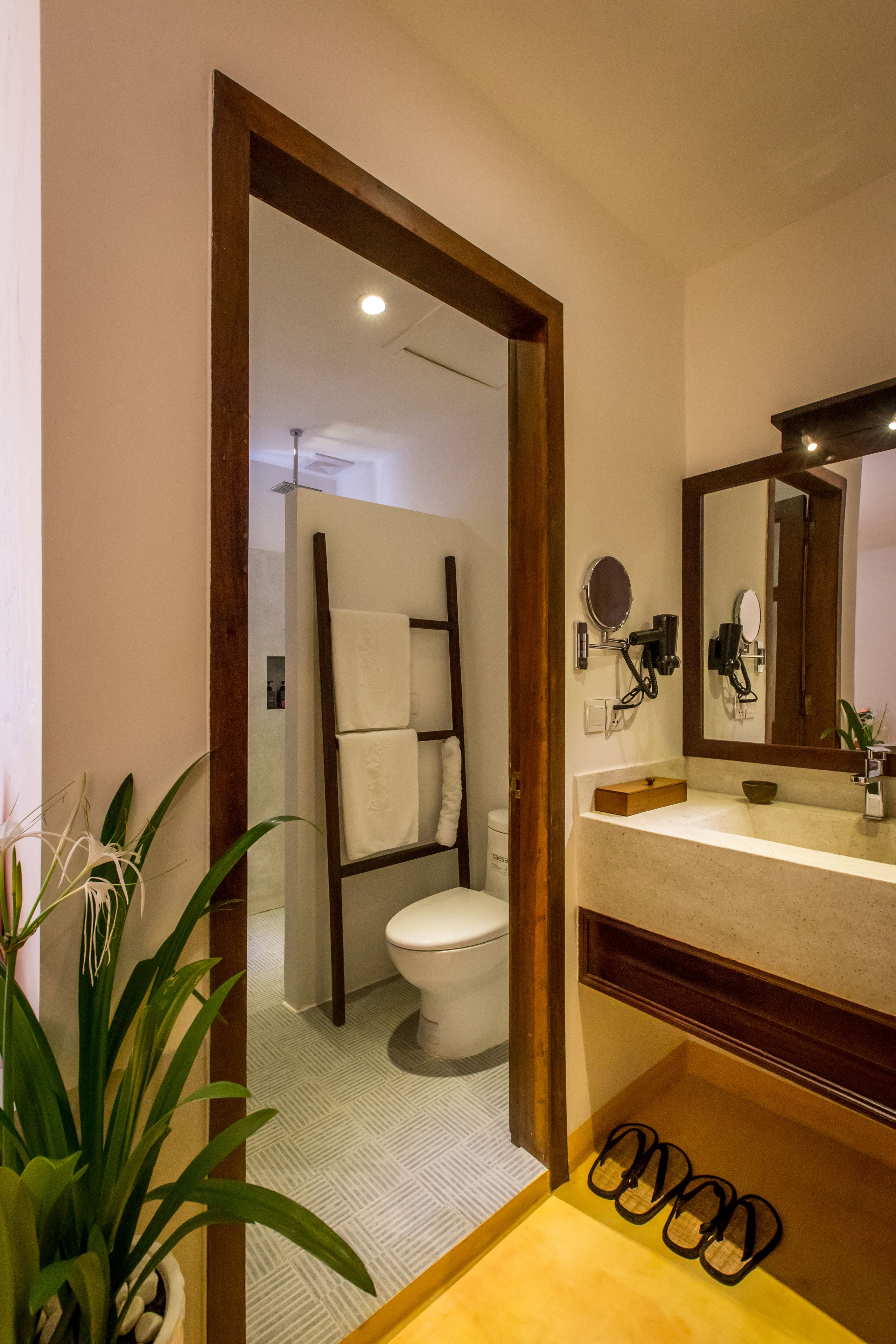 designer toiletries, hair dryer, bathrobes, slippers