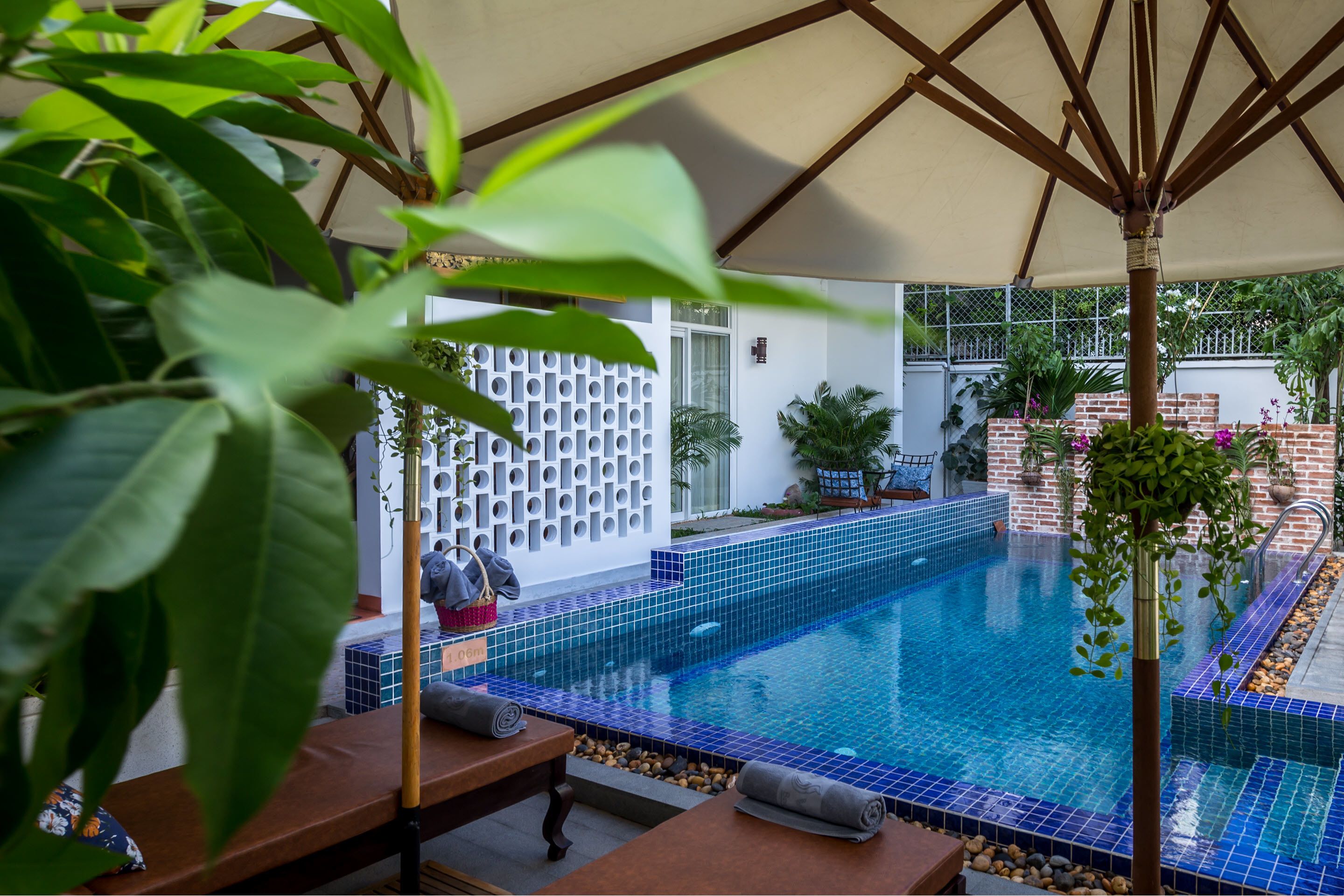 outdoor pool, pool umbrellas, pool loungers