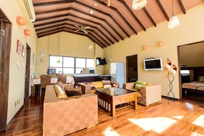 Deluxe Suite, 3 Bedrooms, Non Smoking (3rd Floor, For 1 - 6 People) | Living room | Flat-screen TV